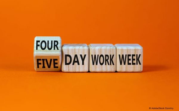 Wooden blocks with text that reads "Four day work week."